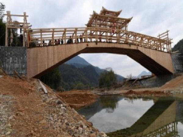 单跨度拱桥施工图资料下载-全国单孔跨度最大的木拱廊桥开建